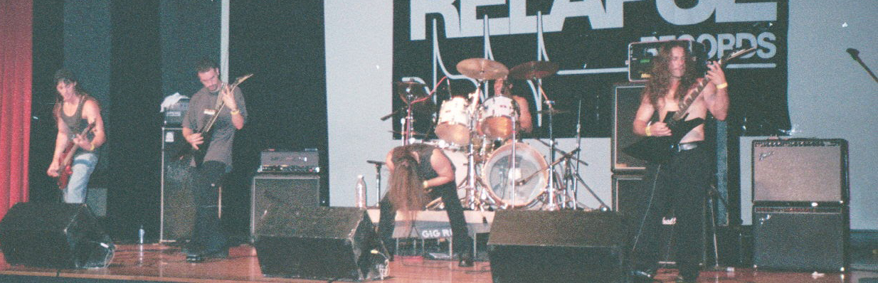 Daryl Parvin, Alex Obradovic, Mike Michaelian, Haywood Payne and Robert Michaelian on the main stage at the Milwaukee Metalfest, 1999